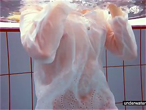 lovely redhead plays naked underwater